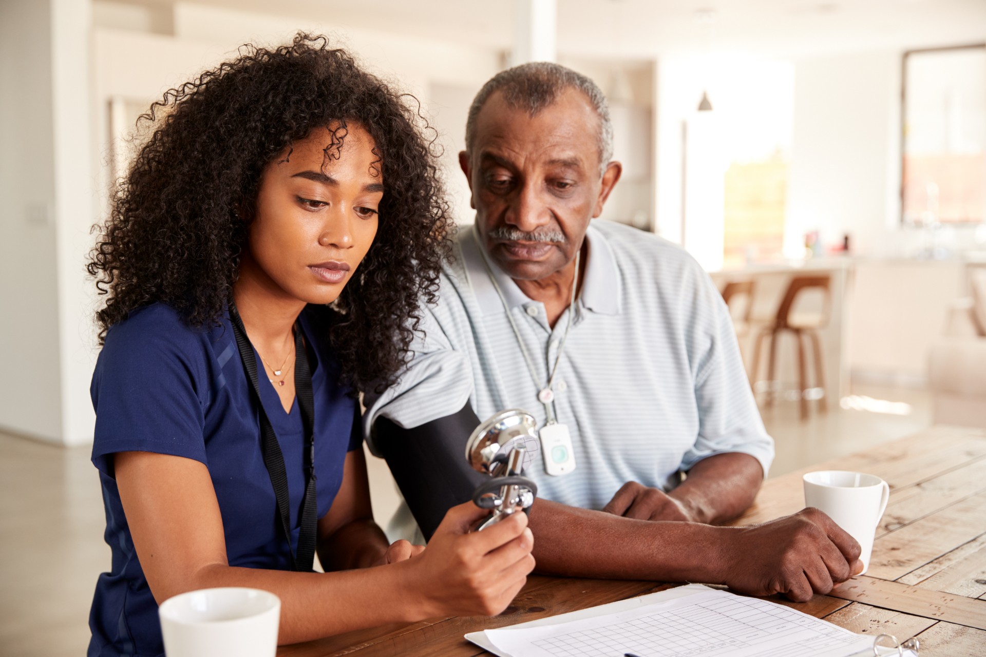 National Nursing and Rehab Clinical Services nurse taking patient blood pressure